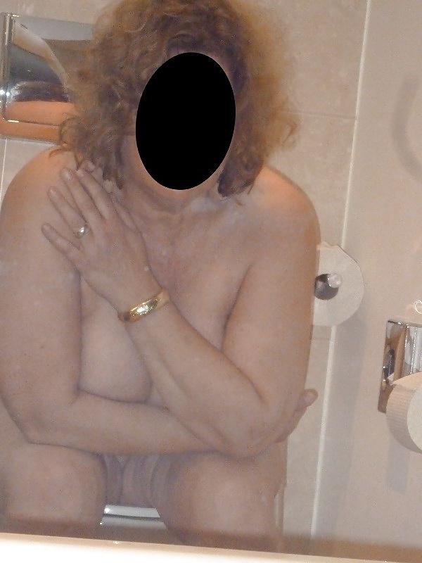12P Housewife  showing her big breasts in the bathroom