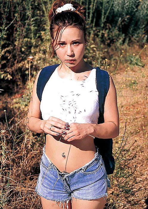 9P Brunette Angelique taking off her clothes outside