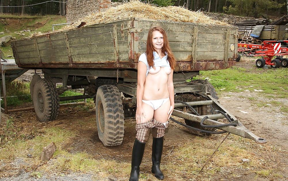 15P Brunett girl plays with her dildo on farm