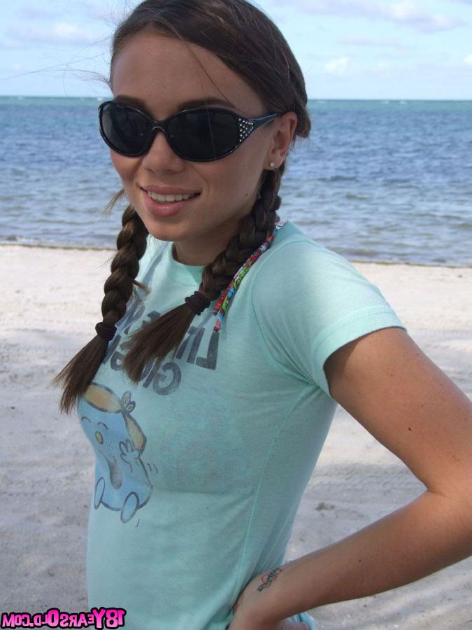 16P Sweet teen girl Alexiss Capri showing off nice ass in thong underwear on beach