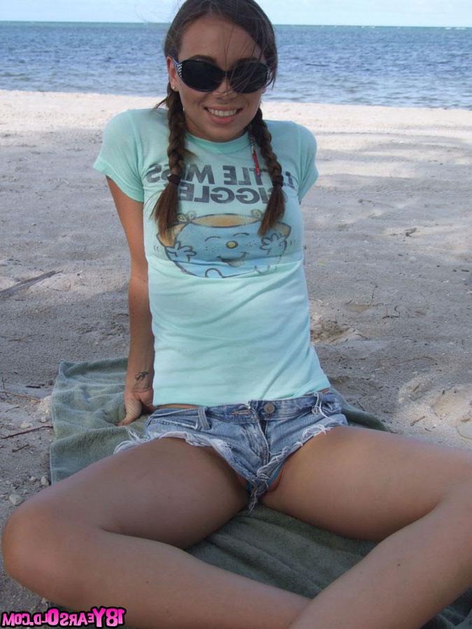 16P Sweet teen girl Alexiss Capri showing off nice ass in thong underwear on beach