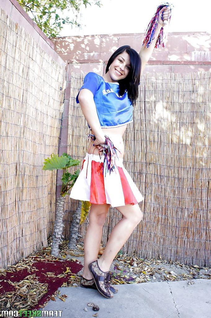 16P Brunette cheerleader Savannah Camden teases her teen as outdoors
