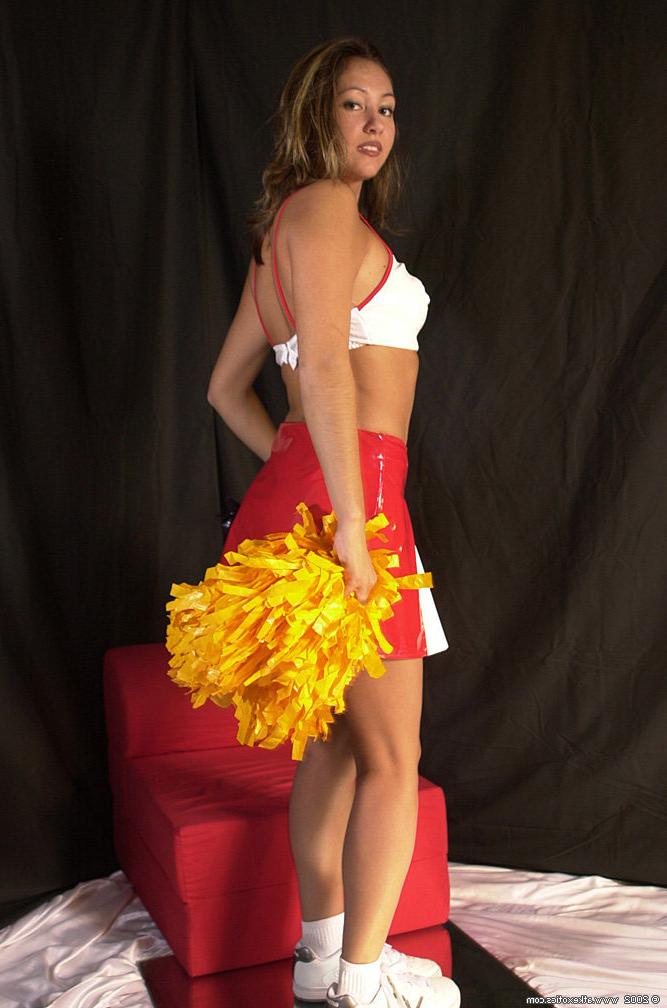 16P Amateur Latina chick Mailia releasing tiny breasts from cheerleader outfit