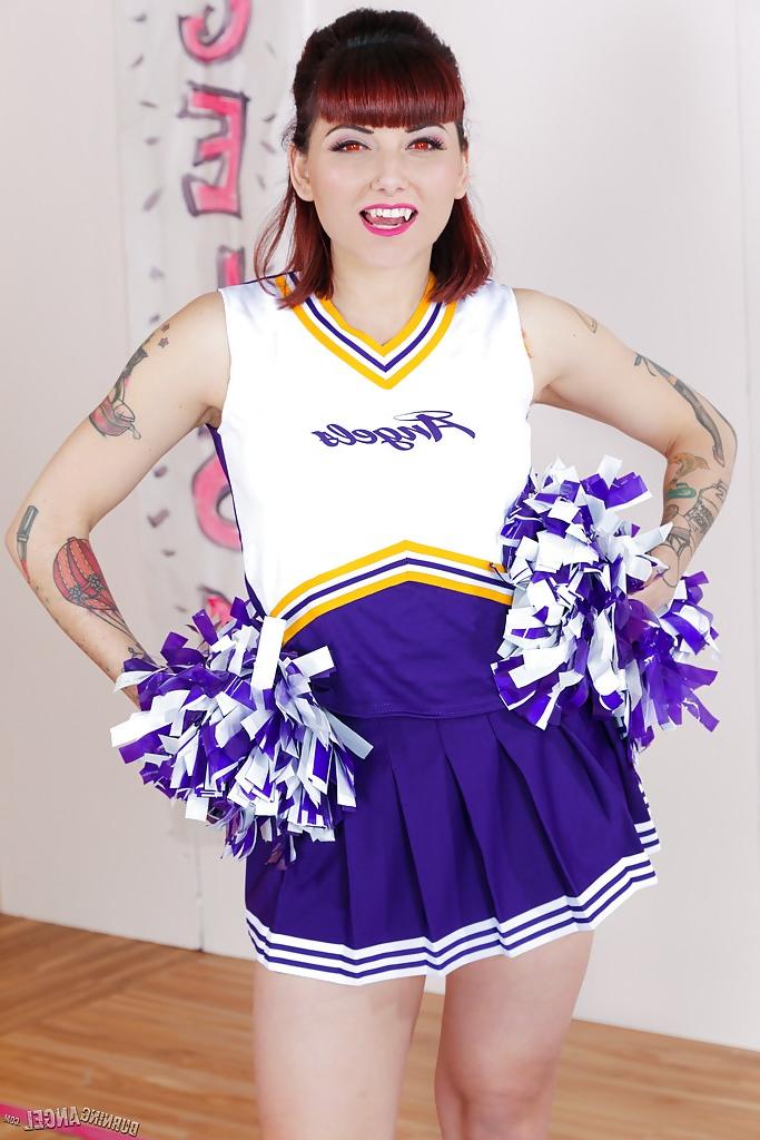 16P Tattooed schoolgirl cheerleader undresses for bald cunt spreading
