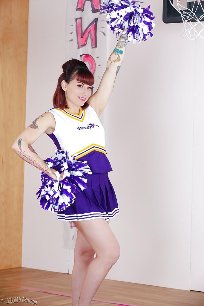 16P Tattooed schoolgirl cheerleader undresses for bald cunt spreading