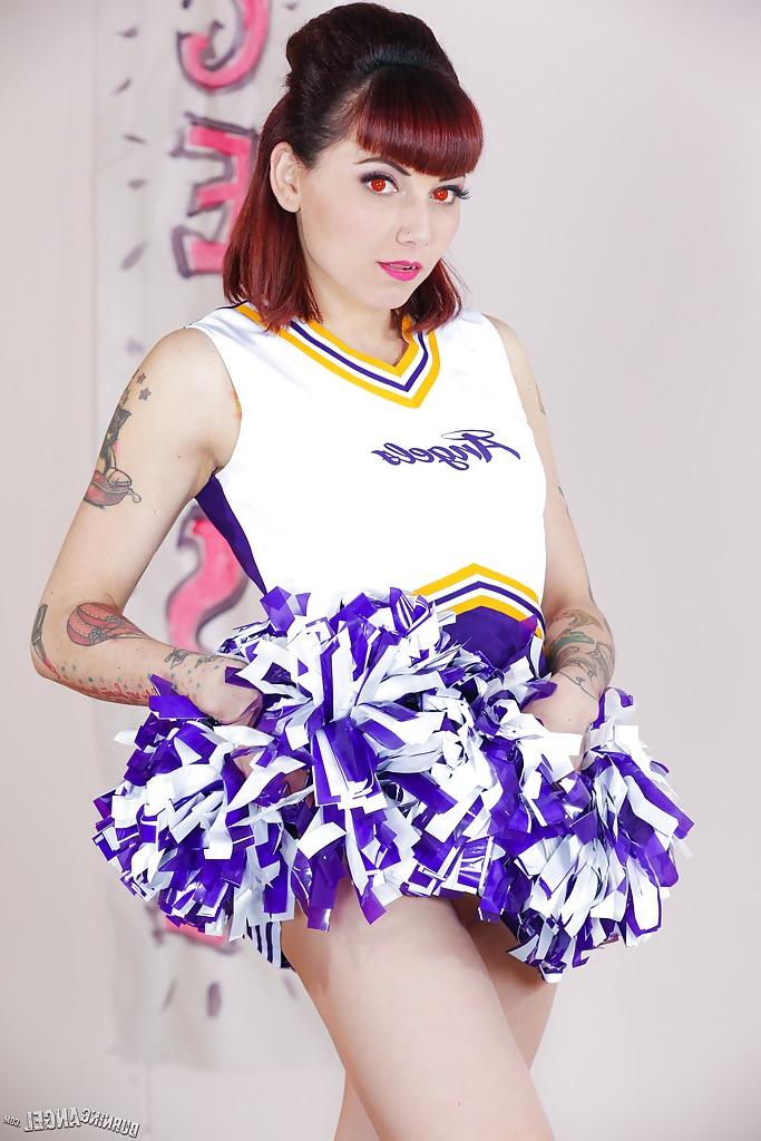 16P Tattooed schoolgirl cheerleader undresses for bald cunt spreading