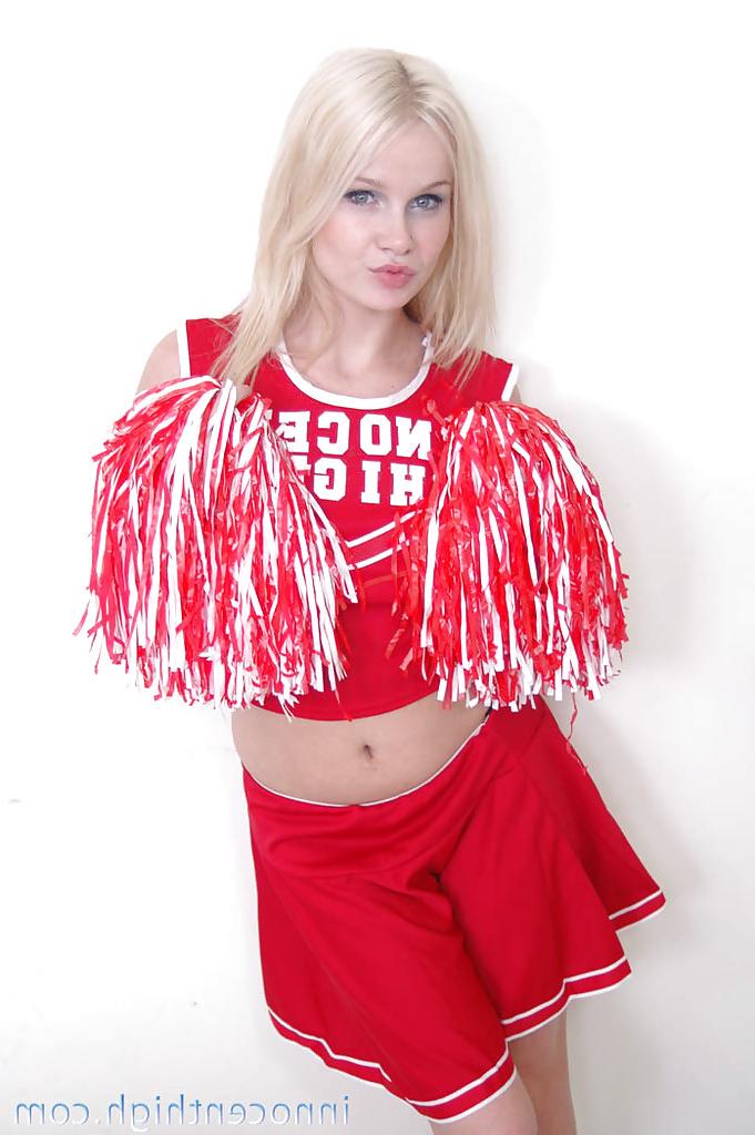 12P Schoolgirl cheerleader Kylee is a blonde babe that is undressing for us