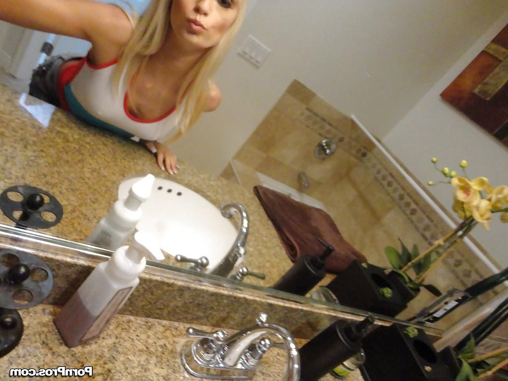 16P Blond chick Erica Fontes taking selfies in mirror while taking off her clothes