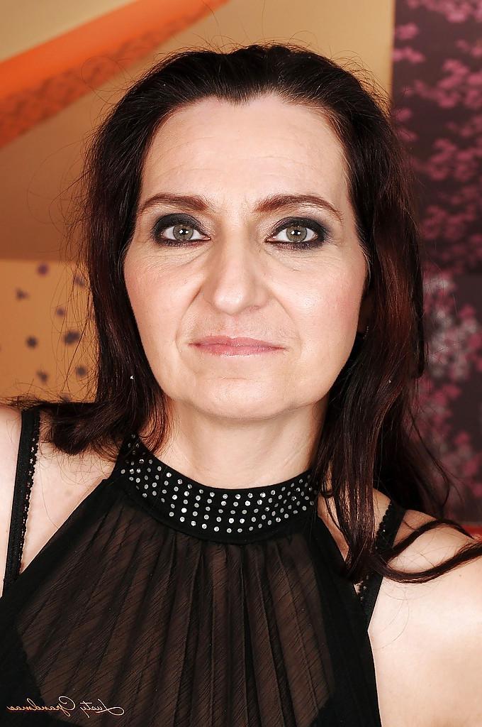 16P Raven haired granny in stockings Liza Bird stripping and spreading her legs
