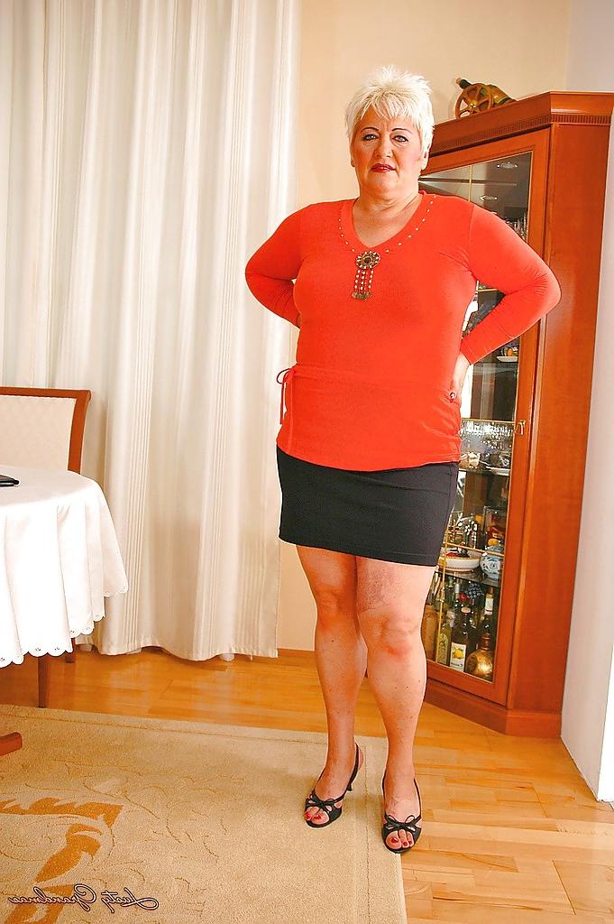 16P Short haired fatty granny with flabby boobs stripping off her clothes