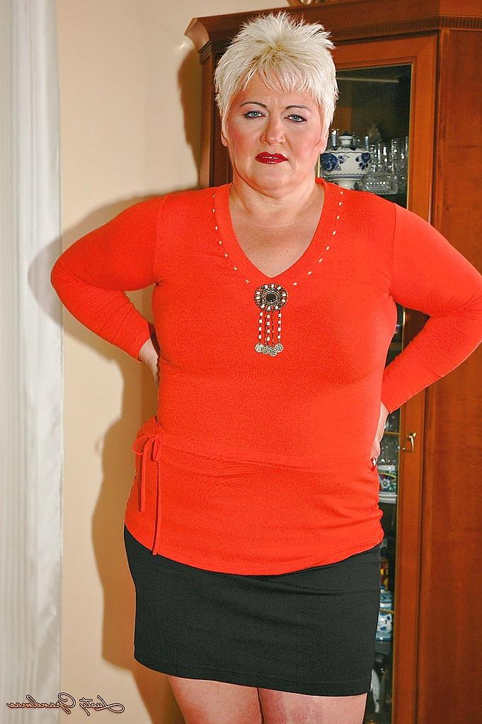 16P Short haired fatty granny with flabby boobs stripping off her clothes
