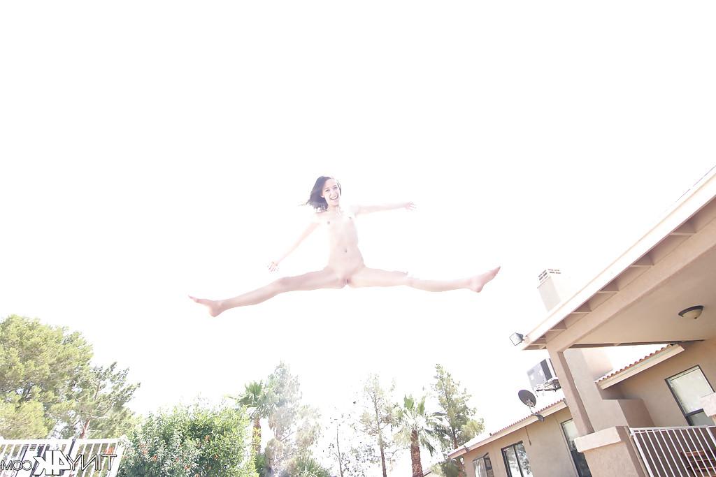 12P Leggy solo girl Lola Hunter poses outdoors beside swimming pool in bikini