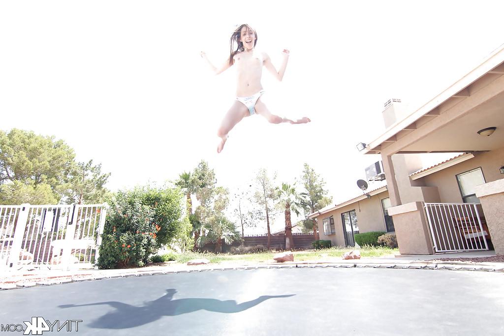 12P Leggy solo girl Lola Hunter poses outdoors beside swimming pool in bikini