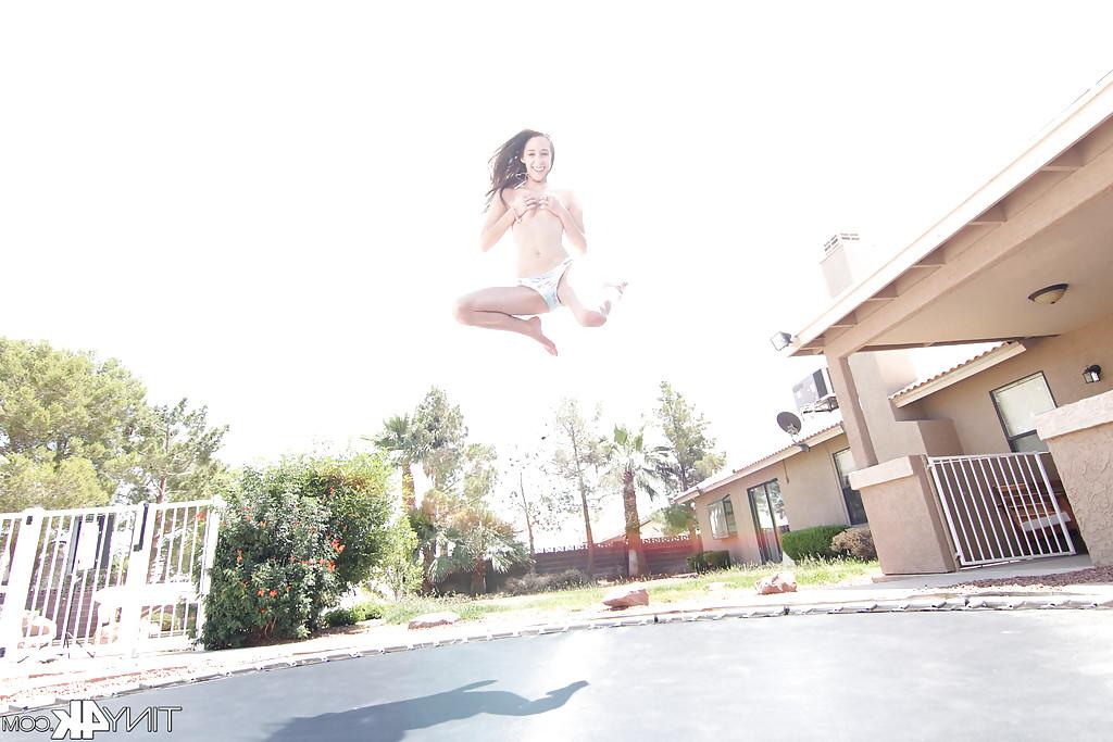 12P Leggy solo girl Lola Hunter poses outdoors beside swimming pool in bikini
