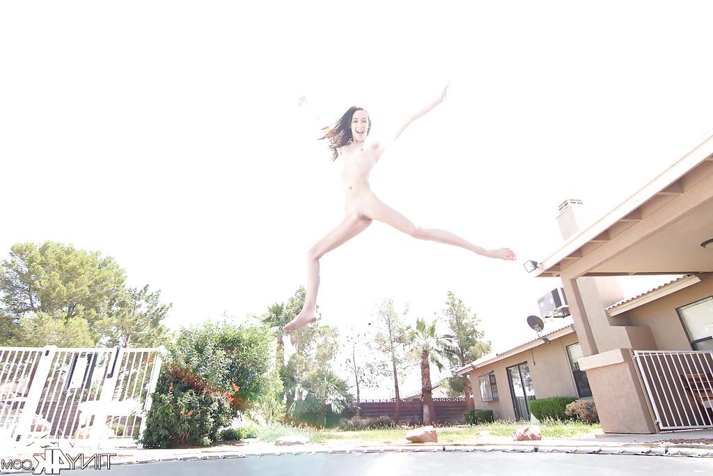 12P Leggy solo girl Lola Hunter poses outdoors beside swimming pool in bikini