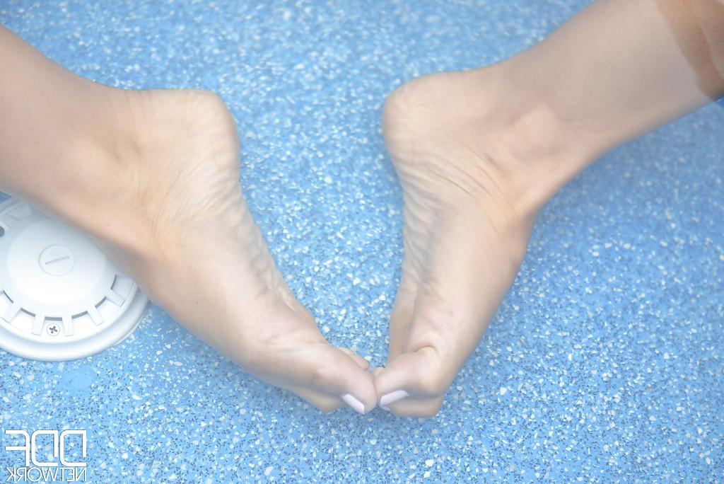 16P Leggy dark haired babe Alexa Tomas toying outdoors by pool in barefeet