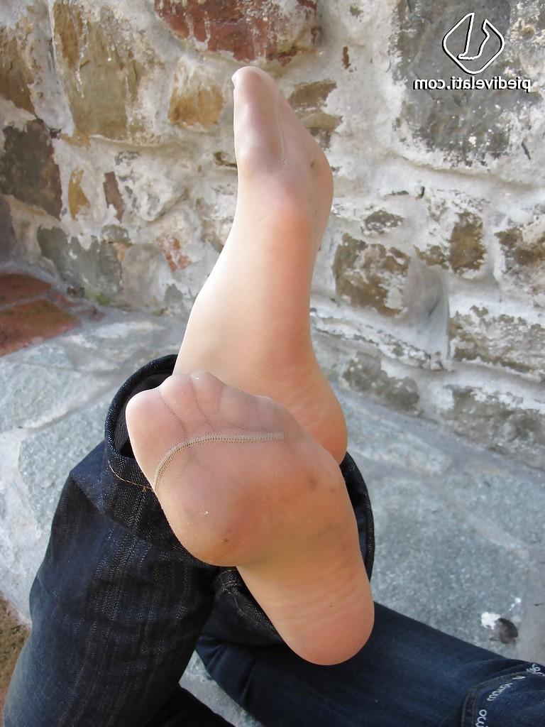 16P Brunette girl Erica adores to show her stunning legs and feet