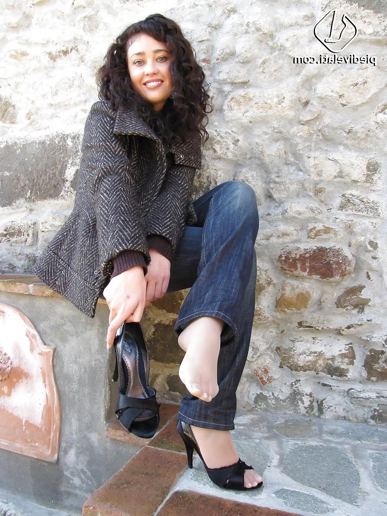 16P Brunette girl Erica adores to show her stunning legs and feet