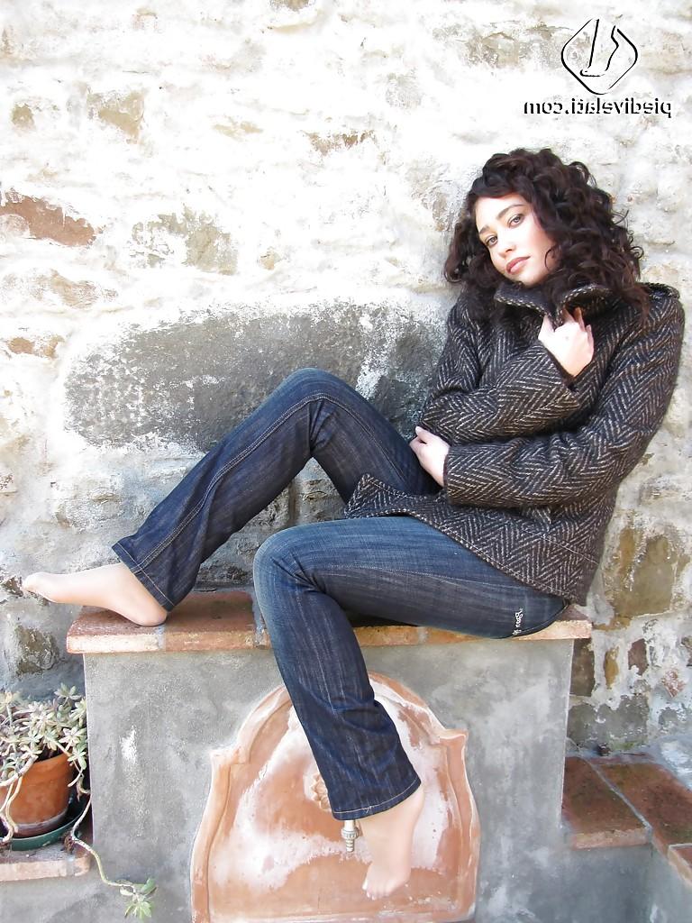 16P Brunette girl Erica adores to show her stunning legs and feet