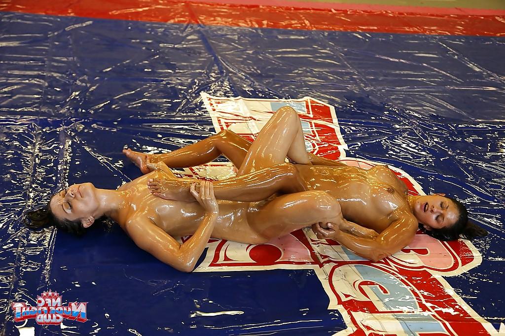 16P Oiled up gals has catfight fun turning into lesbian sex on the wrestling floor