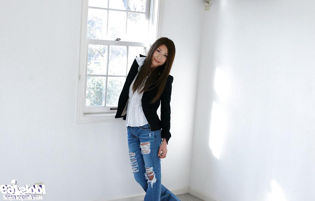 15P Graceful asian girl in jeans Seira Narumi slowly stripping