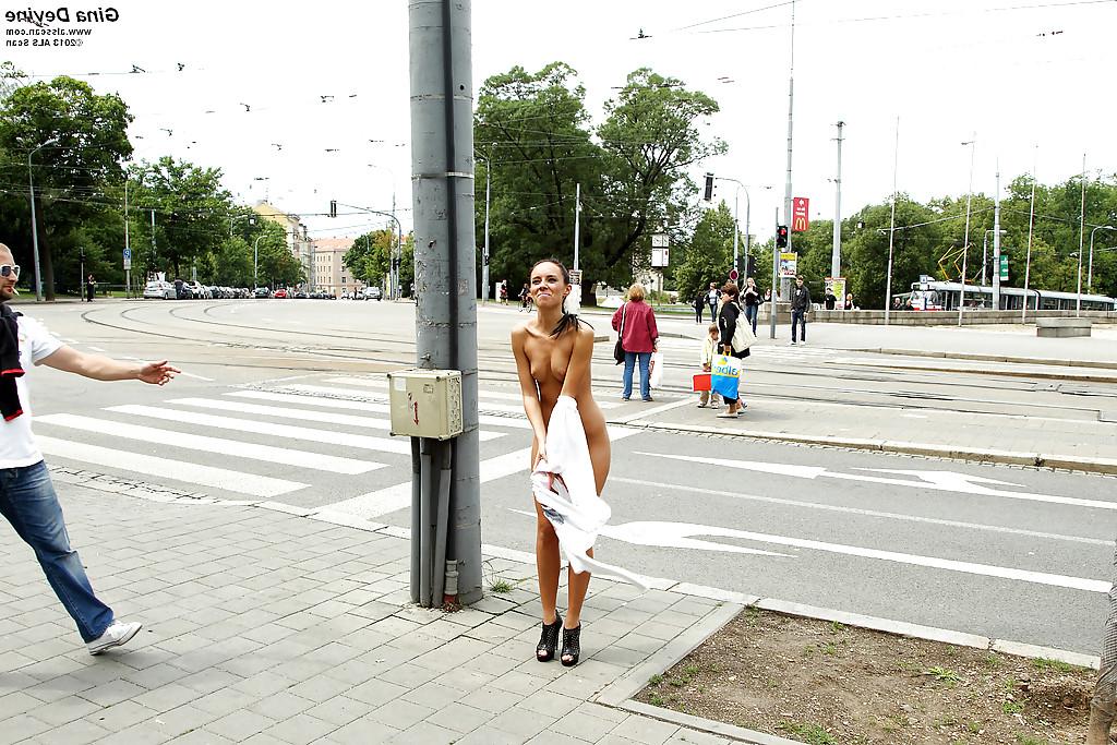 16P Kinky brunette amateur with long legs posing naked in the public place