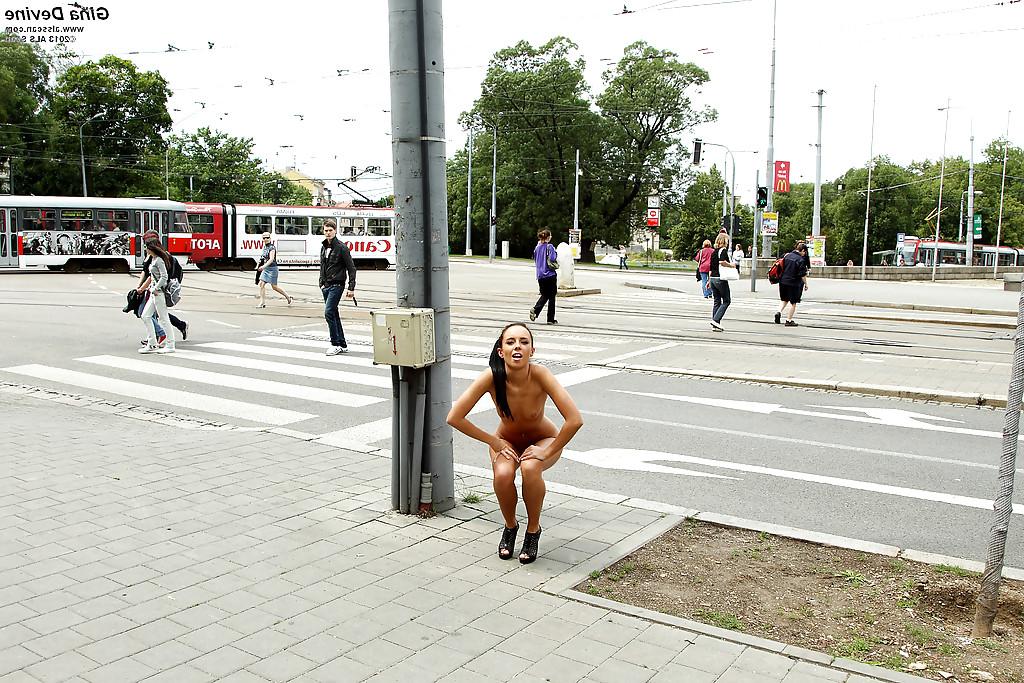 16P Kinky brunette amateur with long legs posing naked in the public place