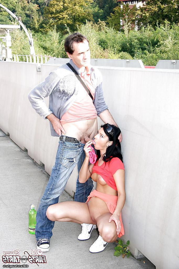 16P Young brunette slut sucks off an older man on public walkway