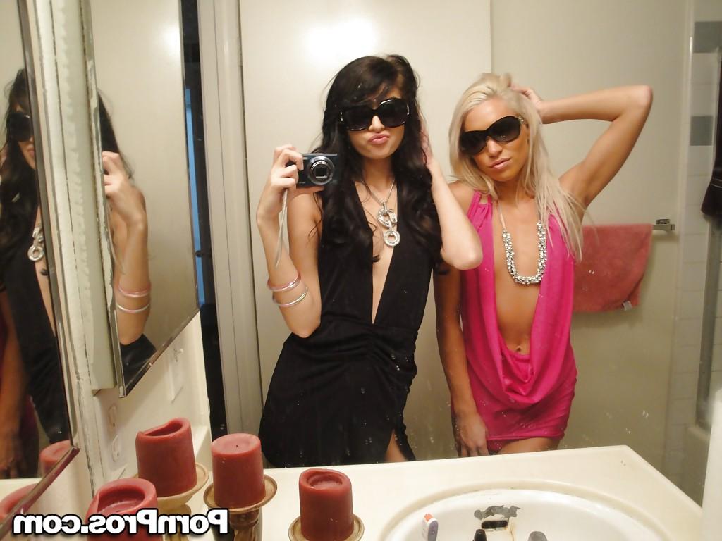 12P Skinny girls Kacey and Zoey showing off teenie tits while taking mirror selfie