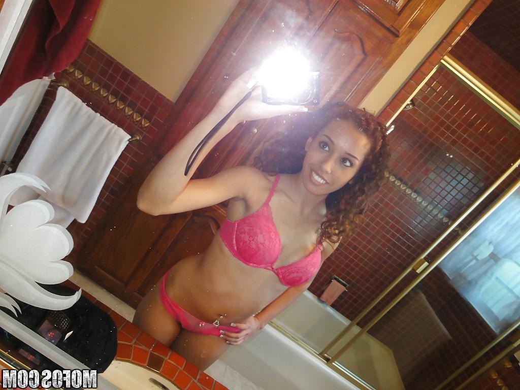 12P Curly-haired latina slipping off her pink lingerie and making selfies