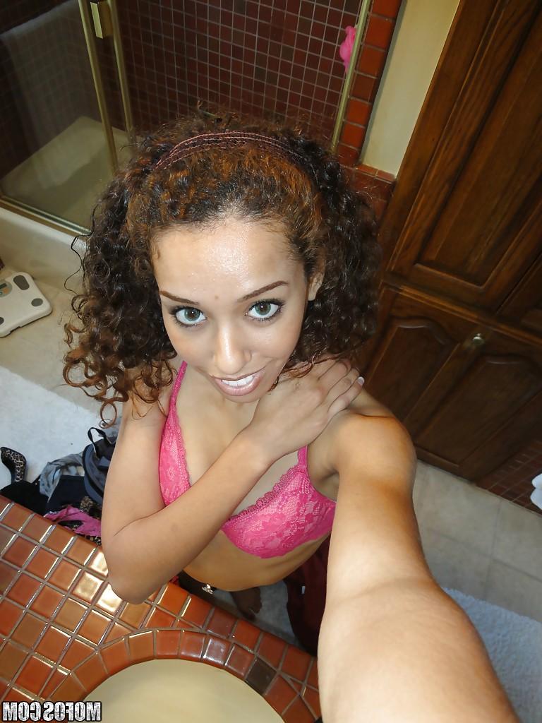 12P Curly-haired latina slipping off her pink lingerie and making selfies