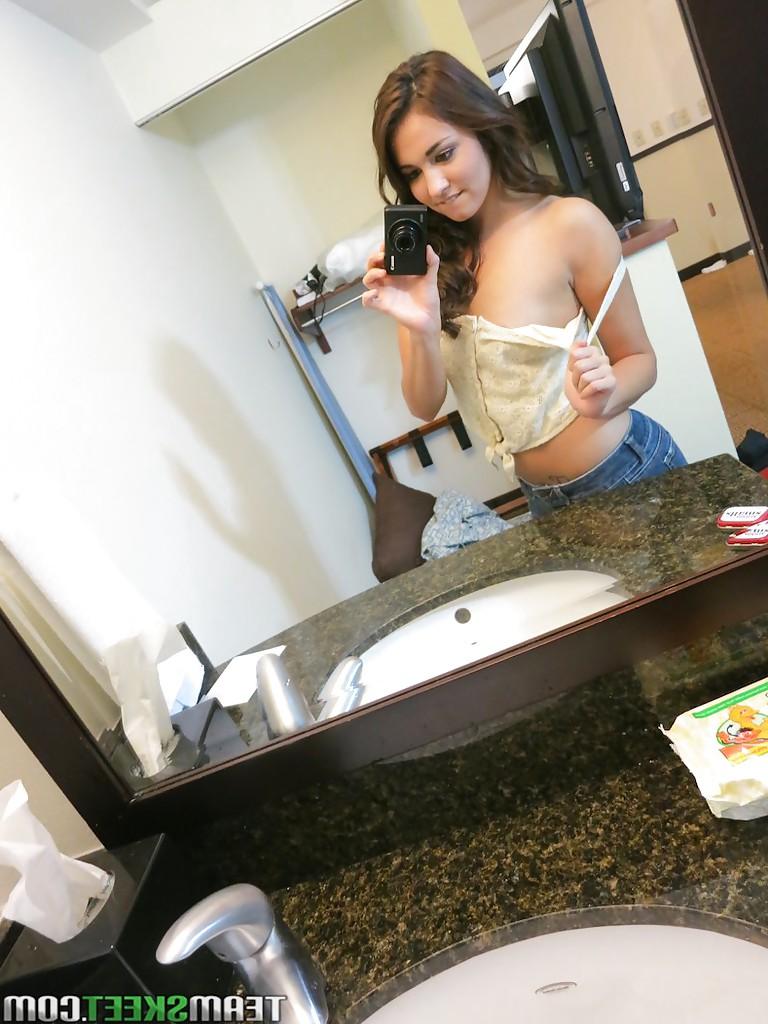 13P Sassy brunette stripping in front of the mirror and making selfies