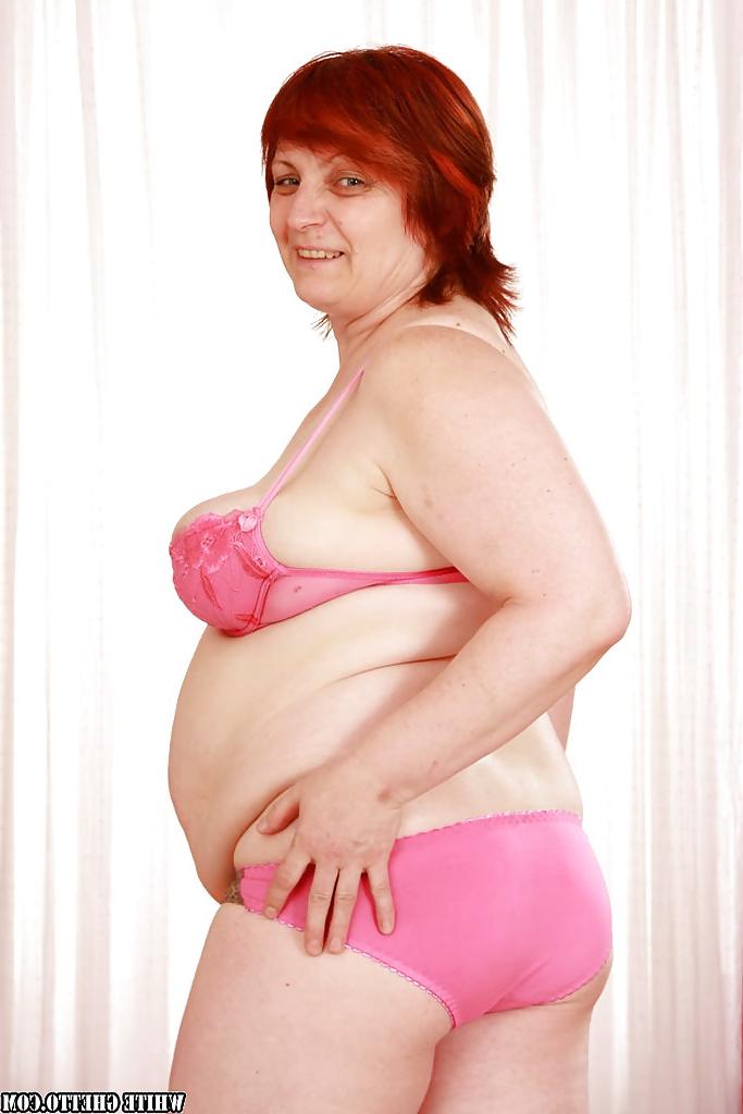 16P Fatty redhead granny with flabby boobs stripping off her clothes