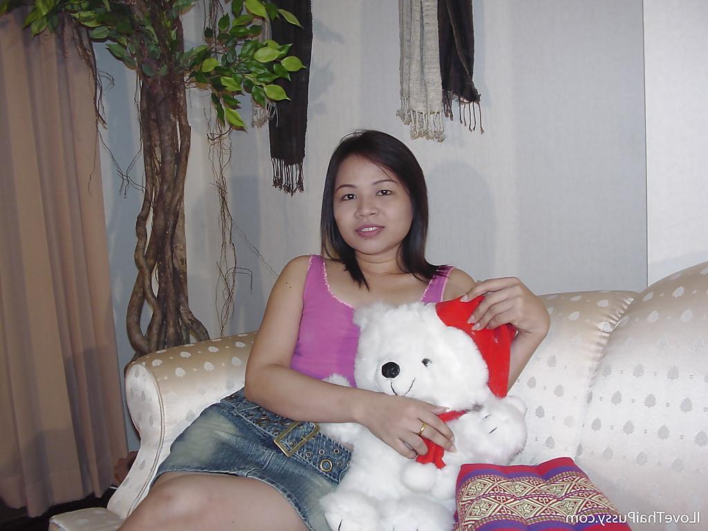 16P Chubby asian cutie taking off her clothes and posing naked on the sofa