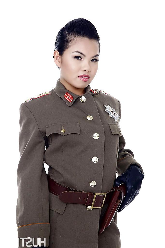16P Oriental pornstar Cindy Starfall posing solo in military garb
