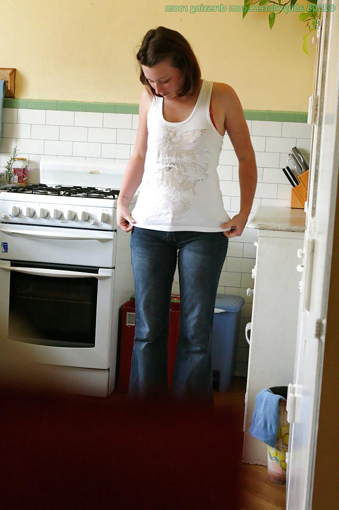 16P Hidden camera catches nude girl getting dressed in the kitchen