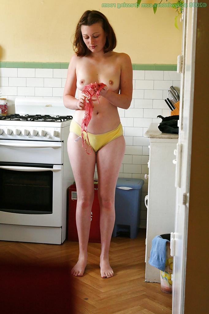 16P Hidden camera catches nude girl getting dressed in the kitchen