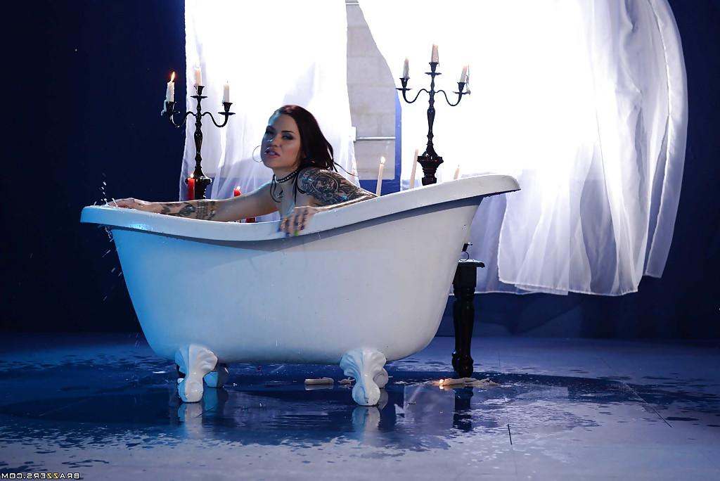 16P Tattooed babe Karmen Karma spreading wet pussy in candle lit bathtub