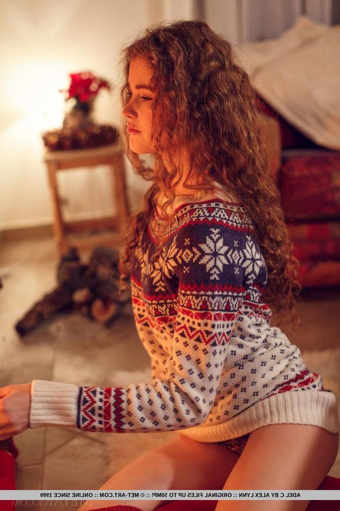 18P Brunette teen Adel C curls up by the fireplace for the holidays