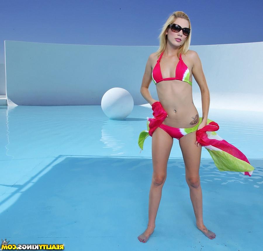 16P Horny babe in bikini and glasses Celeste star poses near azure pool