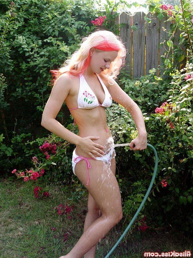 16P Pictures of teen model Alisa Kiss getting wet for you
