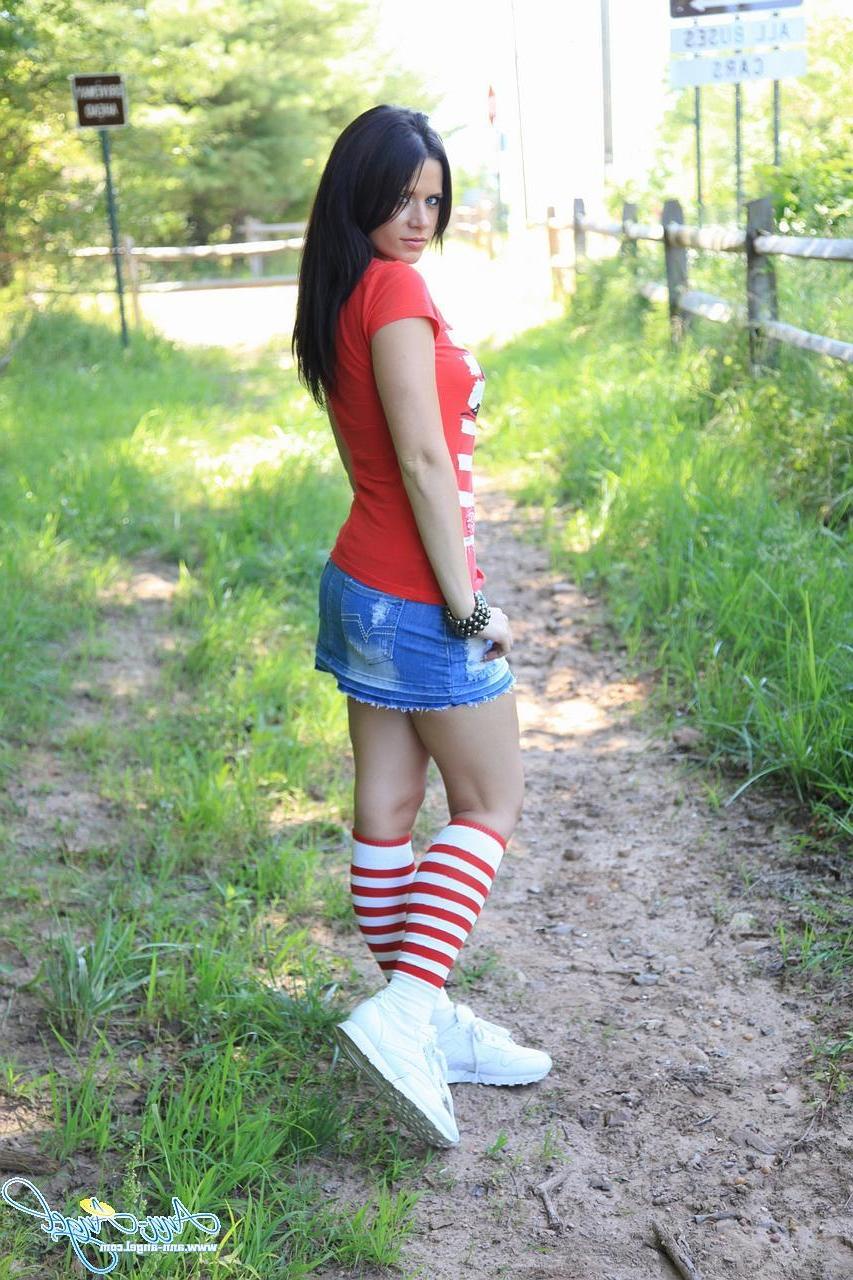 15P Pictures of Ann Angel being a cock-tease outdoors in a short jean miniskirt