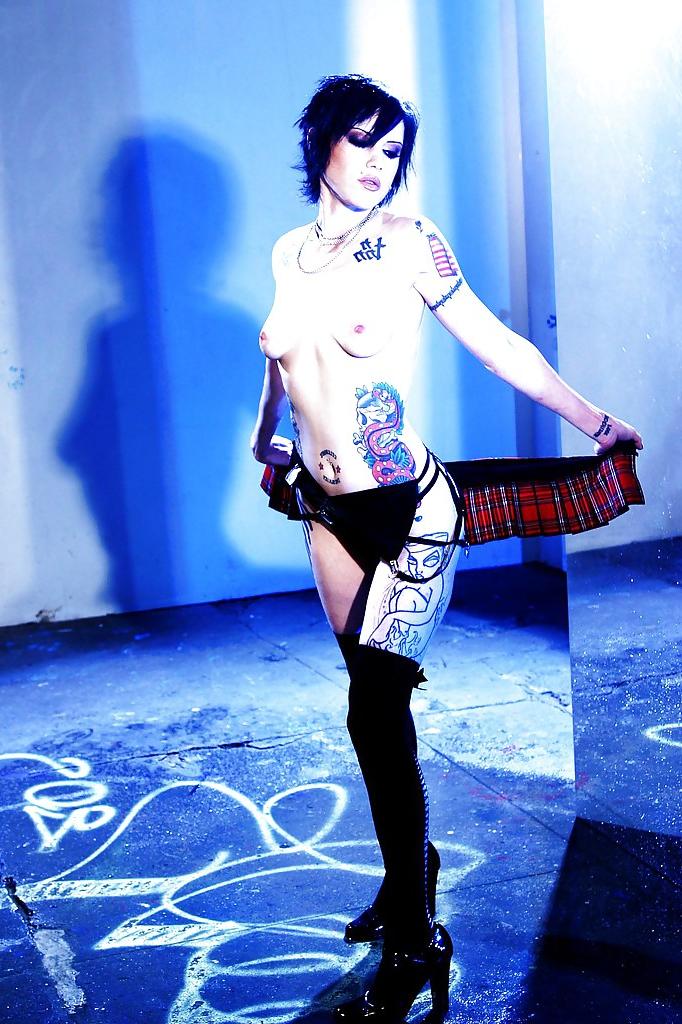 16P Short-haired brunette Cadence St John uncovering her graceful tattooed curves