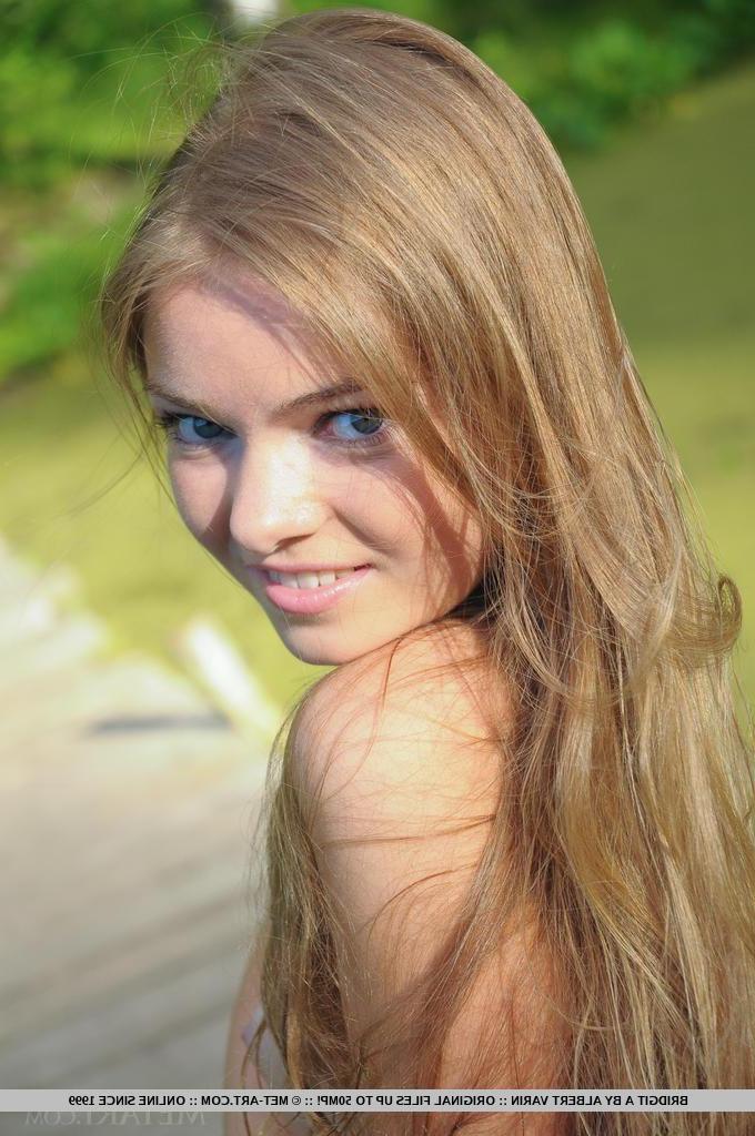 18P Blonde teen Bridgit A displays her super tight body outside