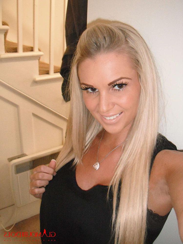 12P Cara Brett at home in her tight jeans showing her big melons