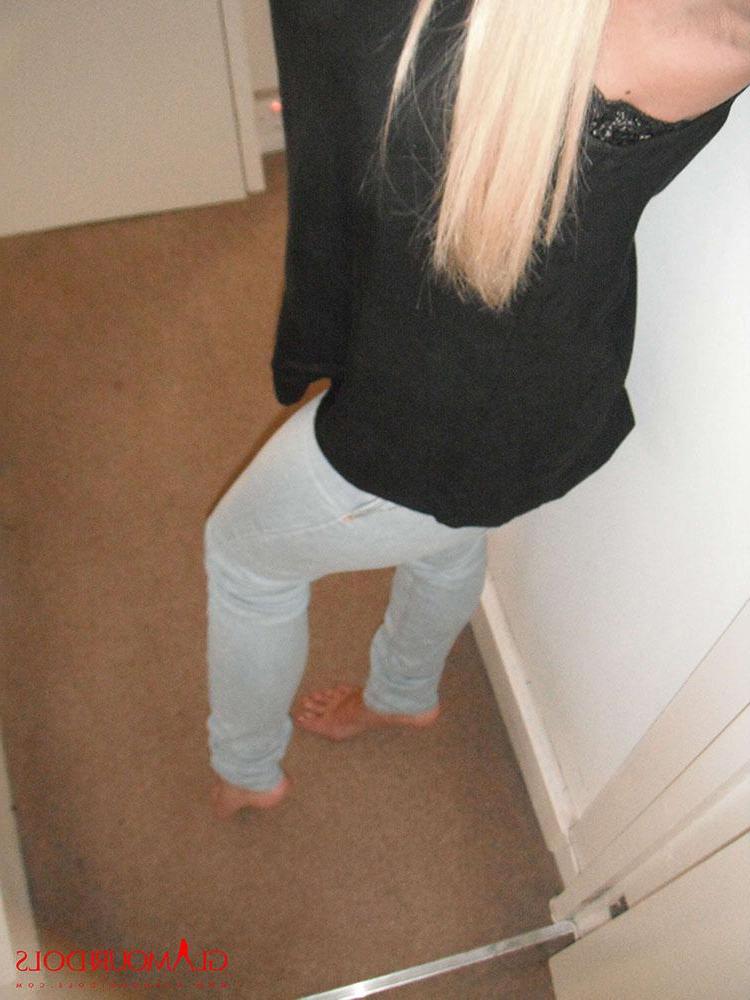 12P Cara Brett at home in her tight jeans showing her big melons
