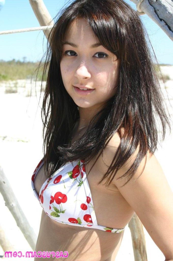 16P Casey on the beach in a cherry bikini