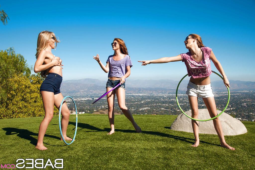 16P 3 girls in shirts and sunglasses undress for outdoor lesbian sex near ocean