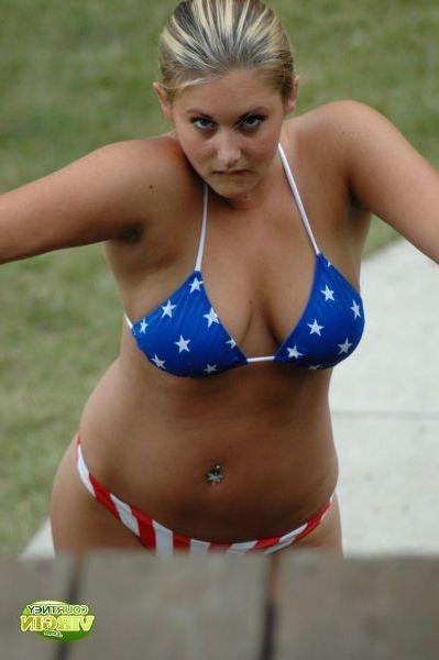 16P Pictures of Courtney Virgin going for a swim in her USA bikini