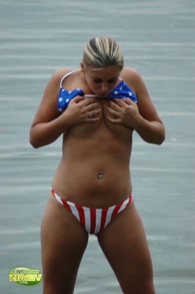 16P Pictures of Courtney Virgin going for a swim in her USA bikini